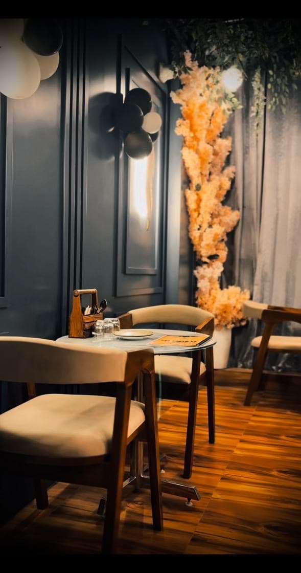 Warm corner table seating inside Flames 147
