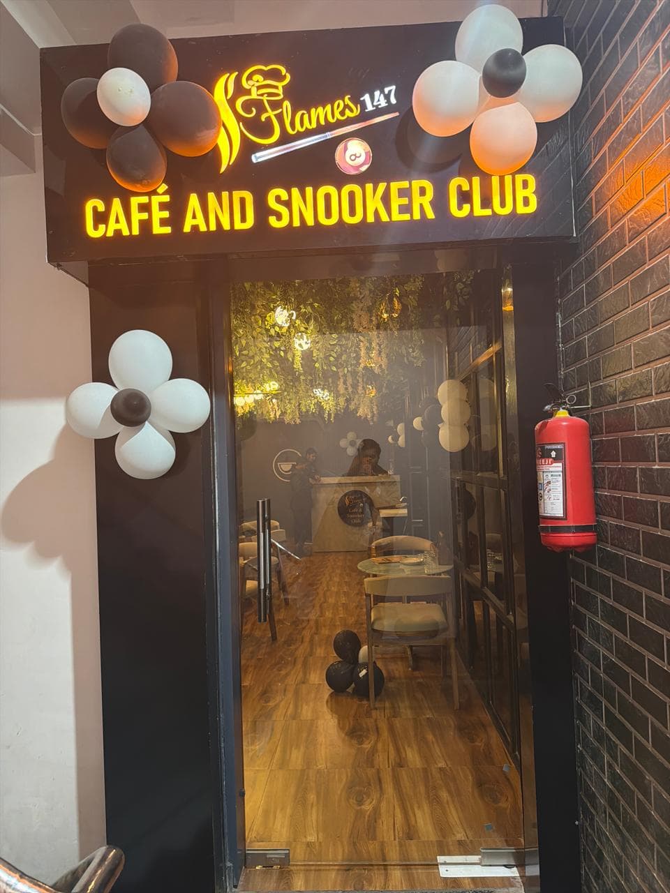 Flames 147 Cafe and Snooker Club entrance signage