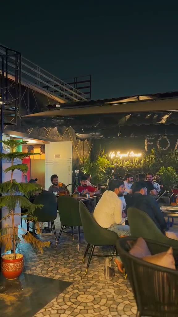 Rooftop evening crowd at Flames